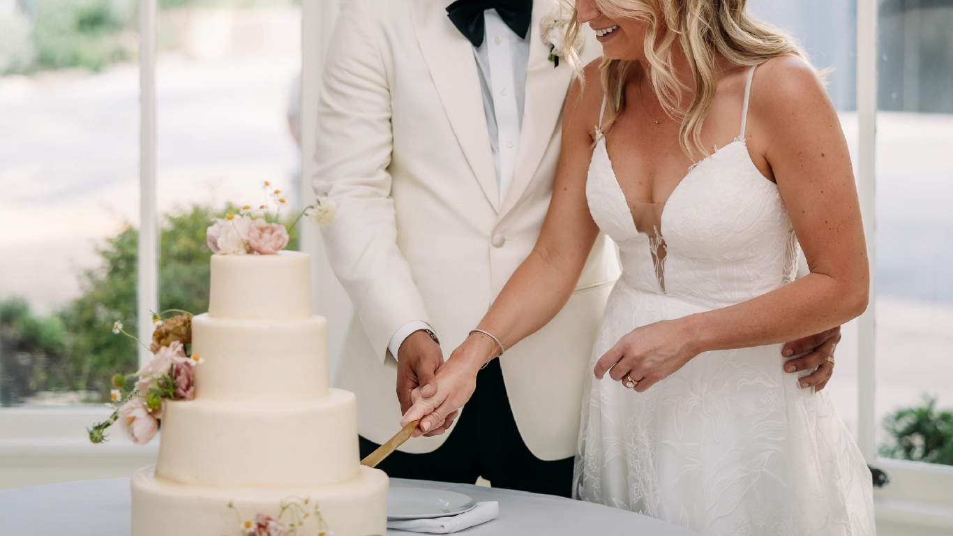 wedding cake cutting at The Allan House